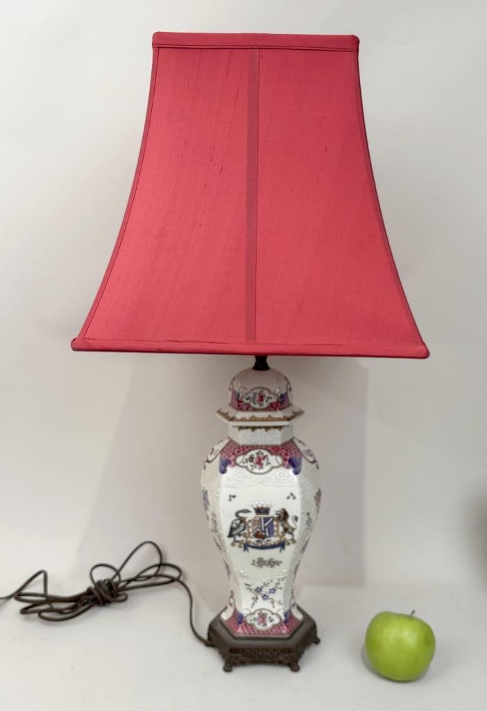 French Samson Porcelain Garniture Lidded Jar: armorial design, as lamp, with oxidized brass cutout footed base, drilled and fitted with red shade. Jar: 14" high.