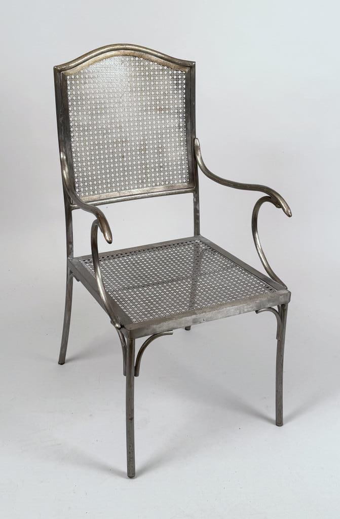 French Metal Bistro Armchair: with scrolled arms and metal sheet "caning". 37 1/4" high, 19 3/4" wide, 22" deep; seat height: 15 1/8" high. Oxidation.
