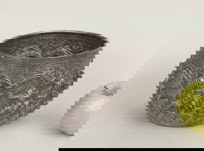 Burmese Repousse Silver Thabeik Bowl: with banded repousse figural vignettes in high relief; test positive for silver content; unmarked. 4 1/2" high, 7" diameter. Weight: 19.100 OZT. Oxidation, soiling.