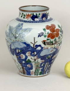 Chinese Wucai Porcelain Jar: with polychrome bird and blossom decoration. 11" high, 9 1/2" diameter. Damage and loss to underside, refer to photos.