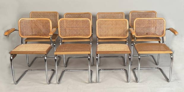 Eight Marcel Breuer Cesca Style MCM Dining Chairs: comprising an assembled set with two arm and six side chairs, maple and tubular steel frame with rattan back and seats, most labeled made in Italy. Circa 1970's. Armchairs: 32" high, 24" wide, 17 1/2"