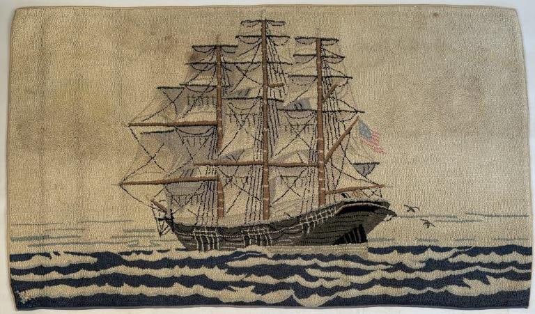 Vintage Large Folk Art Hooked Rug Clipper Ship: three masted rig at full sail in rippled waves, with US flag and gulls following. 48" high, 84 1/2" wide. Some expected wear, repair lower left corner, a few stains and discolorations.