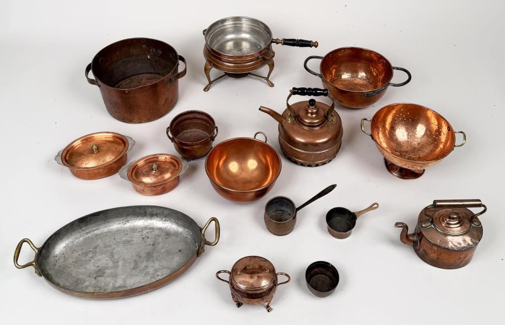 Group Copper Homewares: sixteeen pieces, including kettles, colander, and lidded pots. Largest: 7" high, 13" wide, 10 1/2" deep. Oxidation, age and use wear. Property from the Estate of Bobbie Hainline Howrey.
