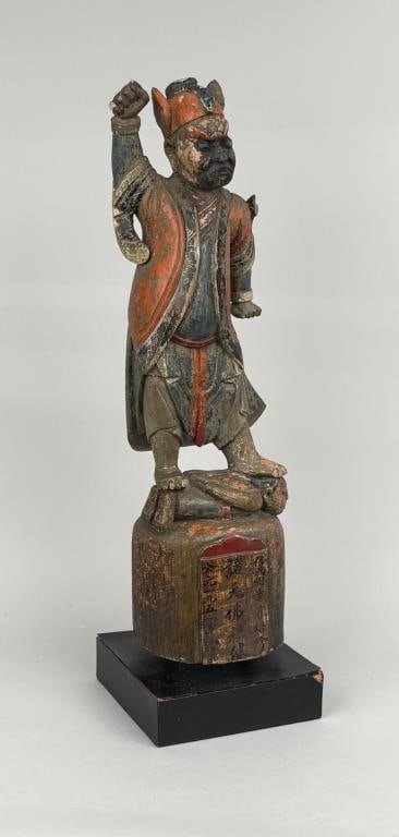 Early Polychrome Carved Wood Asian Figure: depicting warrior, likely tomb guard, with small covered secret compartment on back. 22 1/2" high, 6 1/2" square. Some wear and a few losses, age expected deterioration of surface.