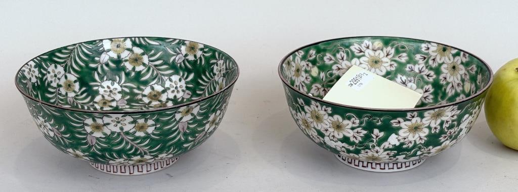 Near Pair Chinese Porcelain Footed Bowls: each with cherry blossoms on a green ground, four character seal mark underside. 2 3/4" high, 6 1/4" diameter. Areas of paint loss to one.