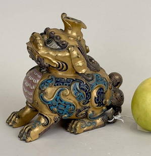 Enameled Gilt Bronze Chinese Foo Lion Censer: finely detailed seated luduan, with archaic champleve motifs and hinged aperture in chest. 6" high, 6" wide, 4" deep.