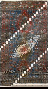 Caucasian Kazak Rug: blue field with three medallions. 5' 9" by 3' 4". Some areas of wear, some frays, all rugs sold as is.
