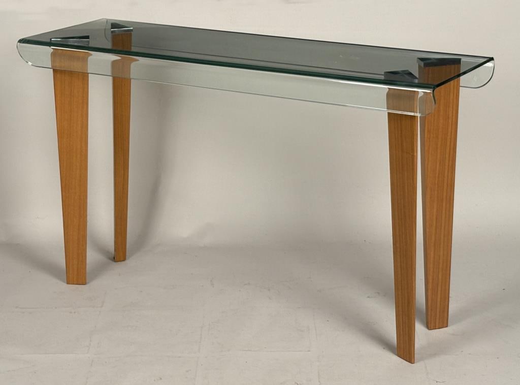 MCM Curved Glass & Wood Sofa/Console Table: with thick curved glass top, four triangular tapering wood legs. 30" high, 54" long, 17 1/2" deep.