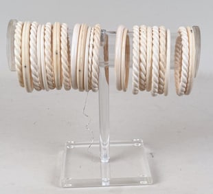 Group Twenty Three Carved Bone Bangle Bracelets