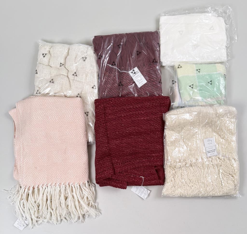 Group "Three Weavers" Hand Woven Poncho Capes: Three Weavers Houston Texas, mostly unopened in bags, two baby blankets without apparent maker. One measured: 80" long, 51" wide. Property from the Estate of Bobbie Hainline Howrey.