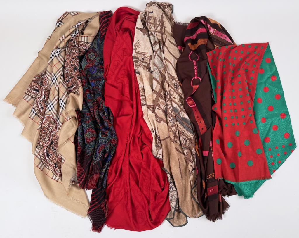 Group Six Designer Wool Blend Shawls: including Giorgio Armani, Gucci, Bill Blass, Gianni Versace & Burberry. Armani: 46" high, 74" long. Staining, use wear. Burberry and Gucci with small holes. Property from the Estate of Bobbie Hainline