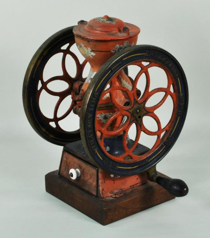 Painted Cast Iron & Wood Enterprise Coffee Grinder: Painted cast iron and wood coffee grinder, #2 Enterprise USA Manufacturing Co., Philadelphia, 19th C., with two large openwork wheels, in original paint. 12 1/2" high, 10" wide. Condition: paint, fini