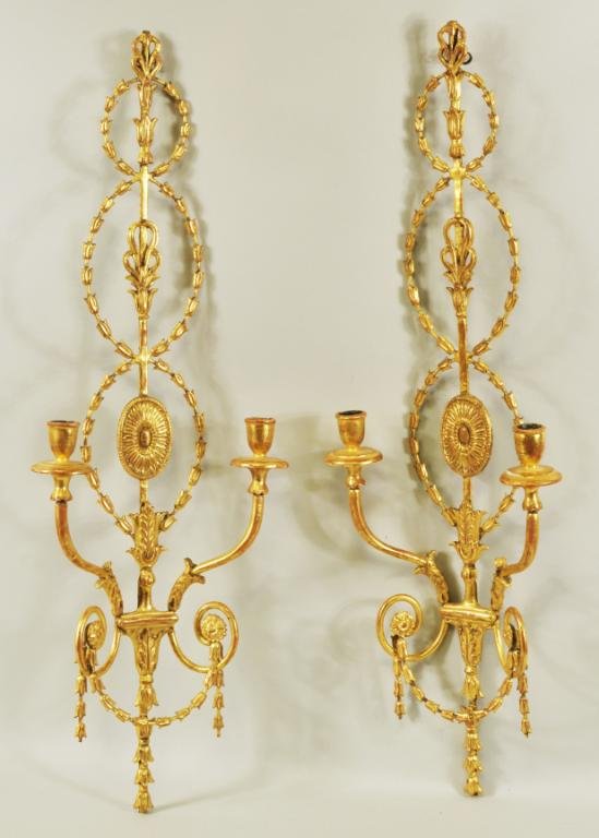 Pair Adam Style Neoclassical Gilded Wall Sconces: Pair of Adam style neoclassical form double arm wall sconces, each having elaborate interlaced husk motifs with anthemion and acanthus leaf ornament with central paterae and two scrolled sconce arms w