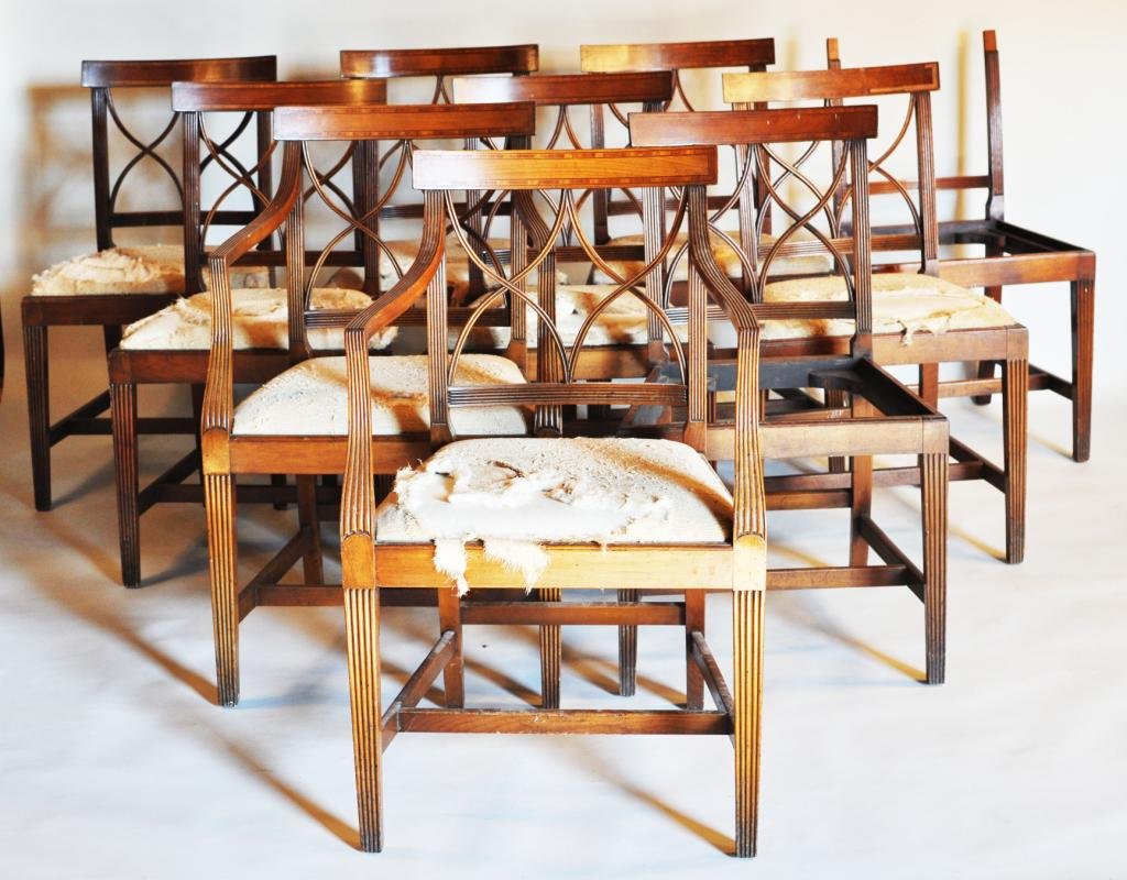 Set Nine Edwardian Inlaid Mahogany Dining Chairs: Set of nine Edwardian inlaid mahogany dining chairs, with inlaid crests and latticework splats, slip seats and stretcher bases, two arm and seven side chairs, late 19th, early 20th C. Largest: 34 3/4"