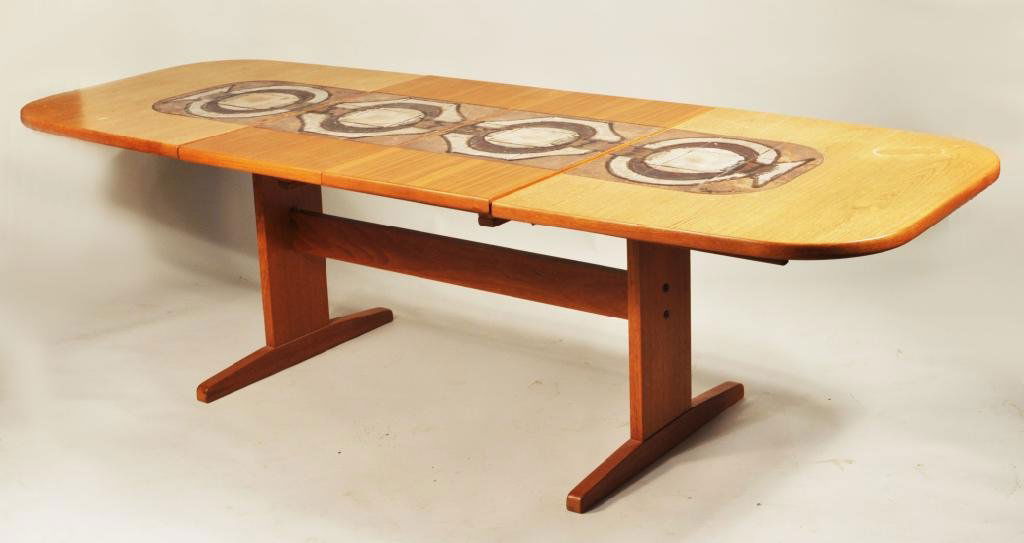 Danish Modern Uldum Walnut & Tile Dining Table: Danish Modern Uldum walnut and tile dining table, the rectangular top with rounded ends and inset tiles forming an abstract motif, on a trestle base, wear consistent with use, . 28 1/4" high, 63" wide