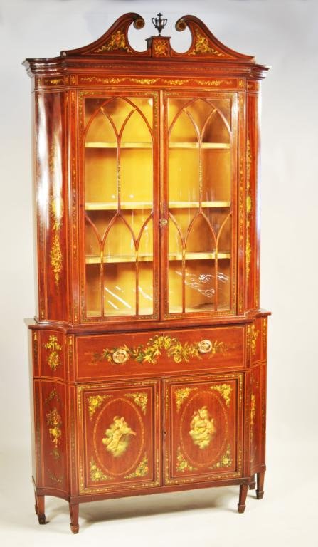 Edwardian Style Paint Decorated Desk & Bookcase: Edwardian style paint decorated desk and bookcase, scrolled pediment over a glazed upper section with gothic mullioned doors, the lower section with desk compartment above a pair of doors, decorated t