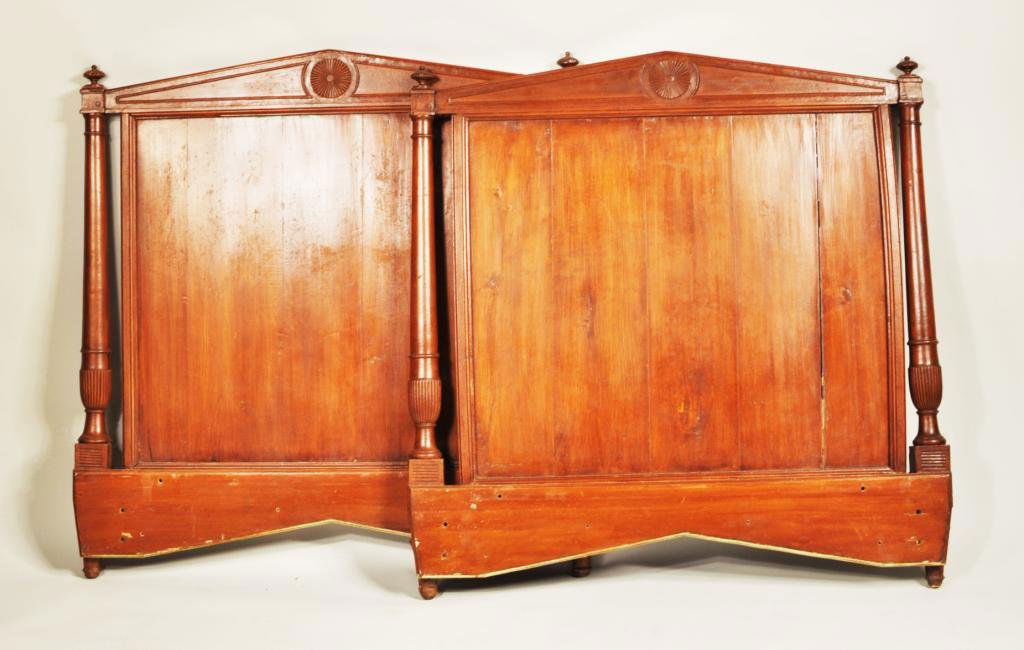 Pair French Empire Style Twin Headboard Frames: Pair French Empire style neoclassical twin headboard frames, with pitched pediment center and turned side columns, late 19th, early 20th C. Each 45 1/2" high, 44 1/4" wide.