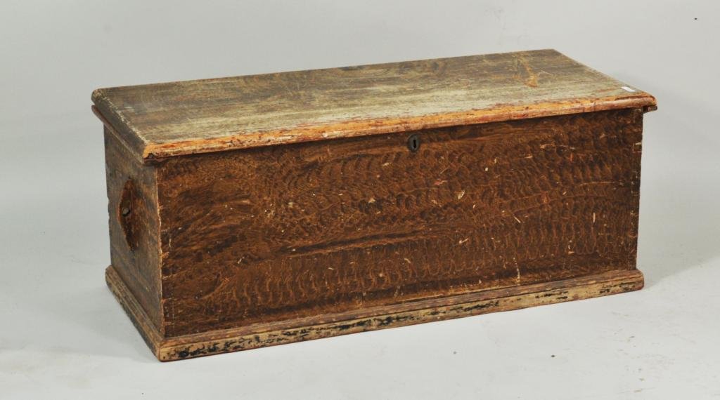 Pennsylvania Paint Decorated Blanket Chest: Pennsylvania paint decorated blanket chest, with putty painted decoration and dovetail construction, 19th C. 17 1/2" high, 43 1/2" wide, 18 3/4" deep.