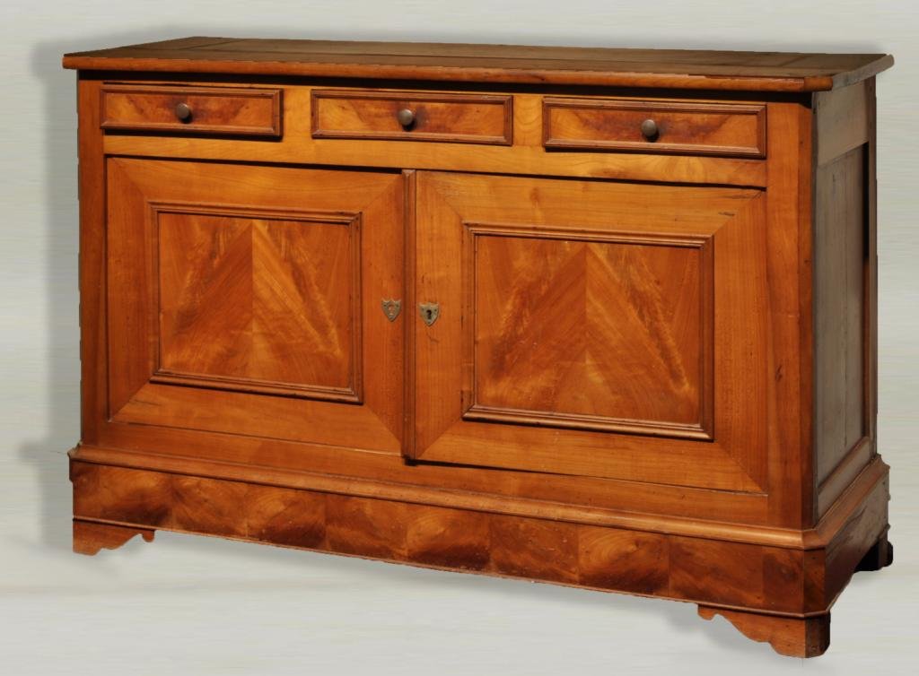 Continental Neoclassical Fruitwood Sideboard: Continental neoclassical fruitwood credenza form sideboard, with three short drawers over two paneled cabinet doors, 19th C. 37 3/4" high, 56 3/4" wide, 20" deep.