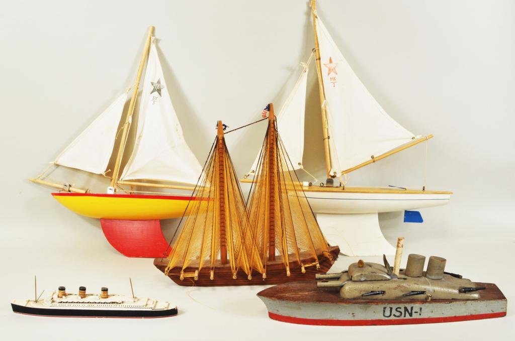Five Wooden Toy Boats: Five wooden toy boats, 20th C., including two vintage English Star yachts of Birkenhead, a vintage Van Ryper Vineyard Haven, Mass, an ocean liner and others. Smallest: 2 3/4" high, 11 1/4" long, large