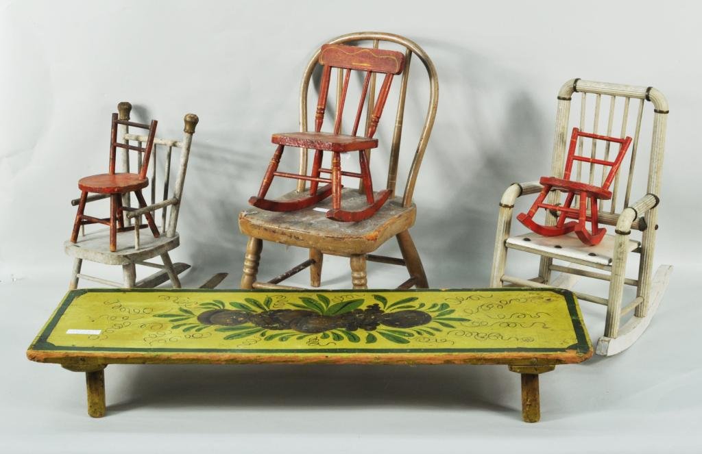 Six Assorted Painted Miniature Child's Chairs: Six assorted painted miniature child's chairs and a footstool, 19th/20th C., including a Windsor side chair in mushroom paint with white striping and two red rockers and a low footstool with stenciled