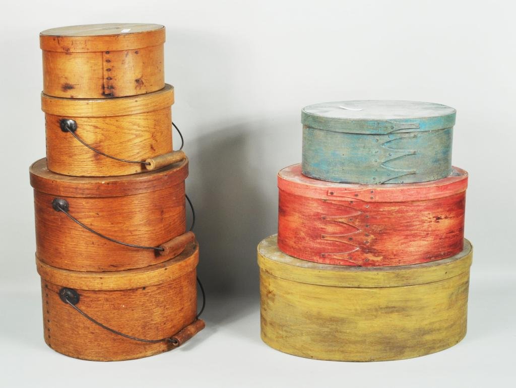 Seven Bentwood Boxes, Shaker Style, 19th C.: Seven bentwood boxes, 19th C., comprising four maple and oak pantry boxes the largest with lid stamped N & J Howe & Co. Fitzwilliam, NH, and three painted oval maple Shaker style boxes. Largest: 7" hi