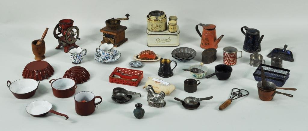 Large Group Dollhouse Miniatures: Large group of dollhouse and miniature tin, metal and wood kitchen related items, 19th/20th C, including two cast iron coffee mills, two tole teapots, hen mold, two cutlery boxes and implements and ma