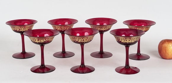 Seven Cranberry & Gilt Glass Coupes