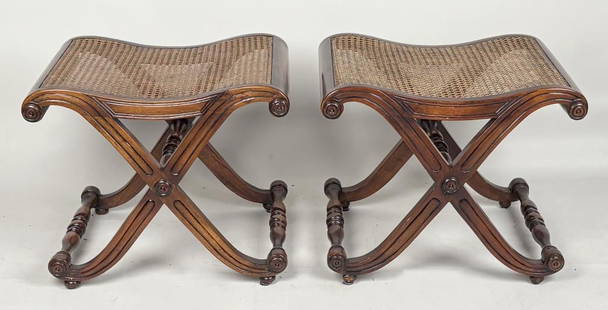 Pair Regency Mahogany Caned Curule Base Stools: with saddle form seats, intersecting curule legged bases, inset molded legs with applied roundels and button feet. 19" high,