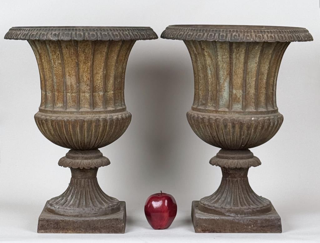 Pair Antique Cast Iron Garden Urns: fluted campana form with square bases. 19 1/2" high, 14 1/2" diam. Oxidation, age and use wear consistent with outdoor use.