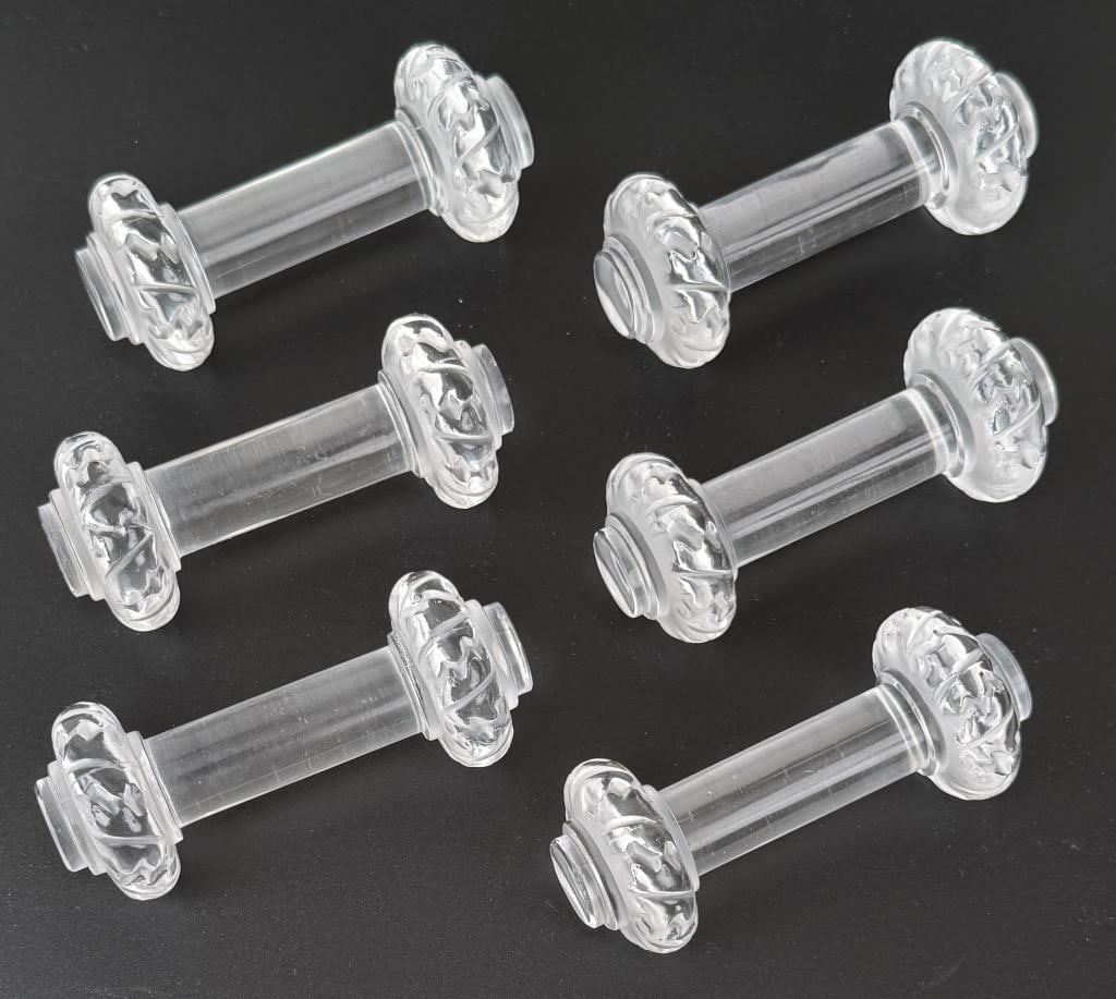 Set Six Lalique Crystal Knife Rests: in the St. Hubert pattern, signed on bases. 1 5/8" high, 3 3/4" wide, 1 1/2" deep. Light use wear, one with edge chips.