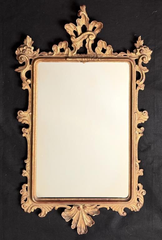 Openwork Carved & Gilt Chippendale Style Mirror: turn of the century with paper label, verso. 42 3/4" high, 26 1/4" wide. Small losses.