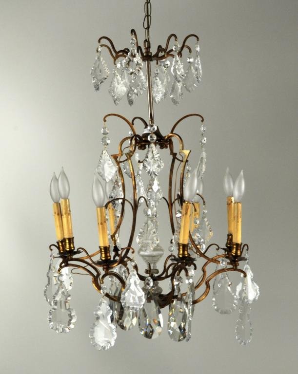 Vintage Brass & Crystal 8-Light Chandelier: Vintage brass and crystal 8-light chandelier, 20th C., with central glass stem and large glass drops. 29" high, 19 1/2" diameter. Condition: missing a few drops.