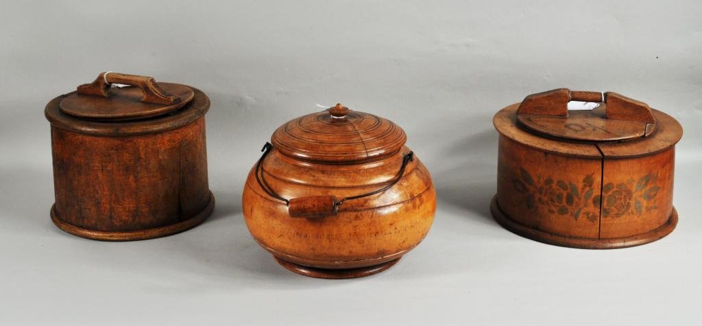 Three Treenware Handled Containers: Three treenware handled containers, 19th C., comprising two cylindrical boxes and a turned birch round container, written on collar "One hundred years old" museum or collection number in lid interior