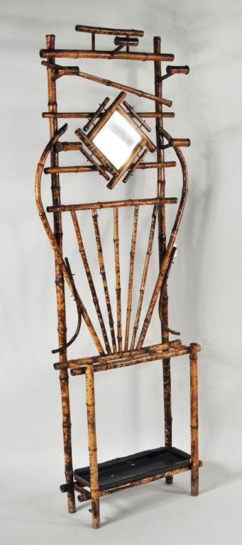 Bamboo Hall Tree, 19th C.: Bamboo hall tree, 19th C., five coat hooks surround small beveled mirror, umbrella stand below with tin drip pan. 79 1/2" high, 30" wide, 9 1/2" deep. Condition: one hook missing end cap, replaced dri