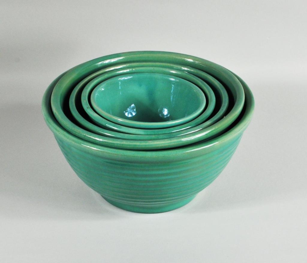 Set Five Green Glazed Stoneware Bowls: Set of five green glazed stoneware bowls, 20th C., impressed on base York P Made in USA. Largest: 5 1/2" high, 9 1/2" diameter; smallest: 3 1/4" high, 5 1/2" diameter. Condition: use wear. Provenance:
