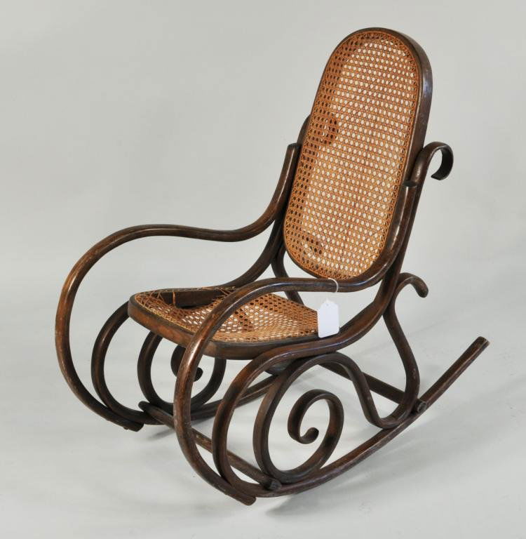 Italian Bentwood Child's Chair: Italian bentwood child's chair, c. 1900, original label on underside with image of a lion and caned chair flanked by the letters S and L, below Marchio Di Fabbrica Depositato. 32" high, 15 1/2" wide,