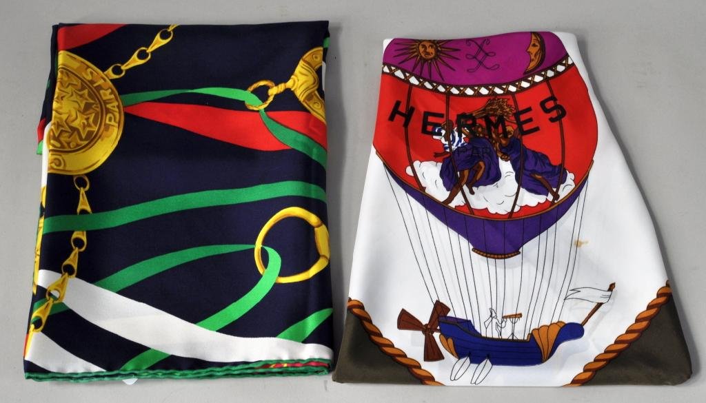 Two Vintage French Silk Scarves: Two vintage French silk scarves, 20th C., comprising an Hermes or Hermes style scarf and a Celine scarf. 34" square. Condition: stains to Hermes.
