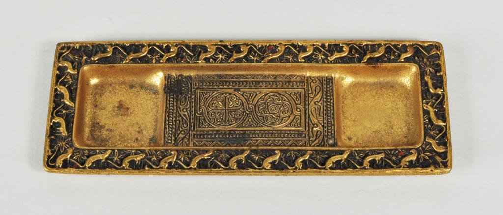 Tiffany Studios "Venetian" Pattern Pen Tray: Tiffany Studios “Venetian” pattern gilt bronze pen tray, with bronze dore finish and ermine motif border, impressed on underside “Tiffany Studios/New York 1642." 4" long, 10" wide.