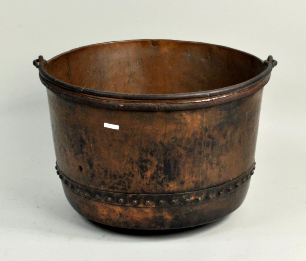 Antique Large Copper Kettle: Very large antique copper kettle, 19th C., with handle. 36" diameter, 28" high. Condition: dents and abrasions, use wear.