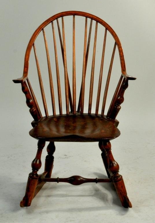 American Continuous Arm Brace Back Windsor: American continuous arm brace back windsor rocker, 18th C., by John Sproson, impressed signature on underside "I. Sproson." 34 1/4" high, 22 1/2" wide, 19 1/2" deep; seat height: 15" high. Mr. Sproson
