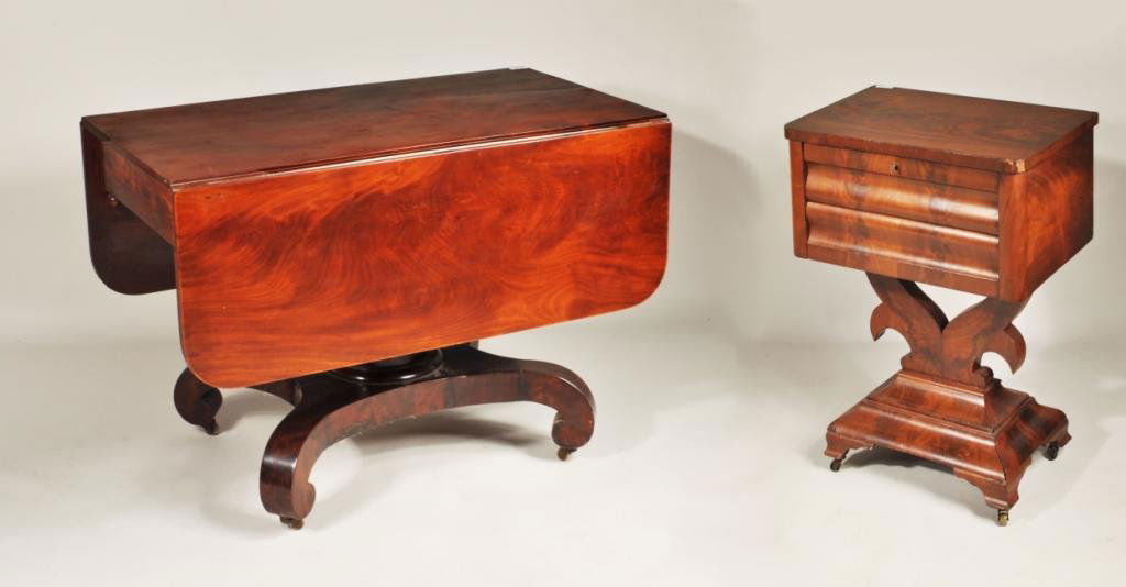 Two American Empire Mahogany Tables: American Empire drop leaf table with figured mahogany and mahogany veneers, acorn drop finials and pedestal base, together with an American Empire mahogany two drawer nightstand, 19th C. Large: 29 1/2