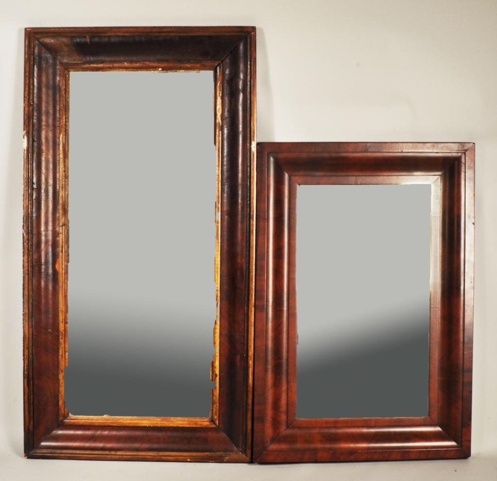 Two American Mahogany Veneered Empire Mirrors: Two American mahogany veneered Empire ogee mirrors, 19th C., both of rectangular form, one parcel-gilt. Large: 47 1/2" high, 25" wide; small: 34 3/4" high, 23 3/4" wide.