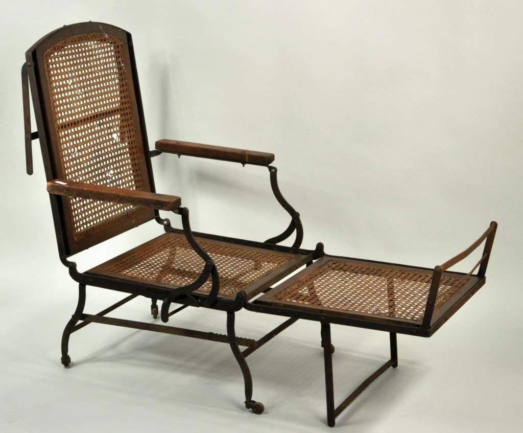 British Campaign Iron Folding Caned Daybed: Campaign daybed, with iron and wood frame and caning, 19th C. 42" high, 27 1/4" wide, 49" deep.