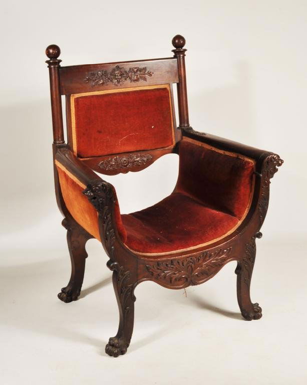 Carved Continental Savonarola Chair: Continental walnut Savonarola chair, with ball and star finials, carved lion head knuckles and paw feet, mid to late 19th C. 42" high, 31" wide, 24 1/2" deep.