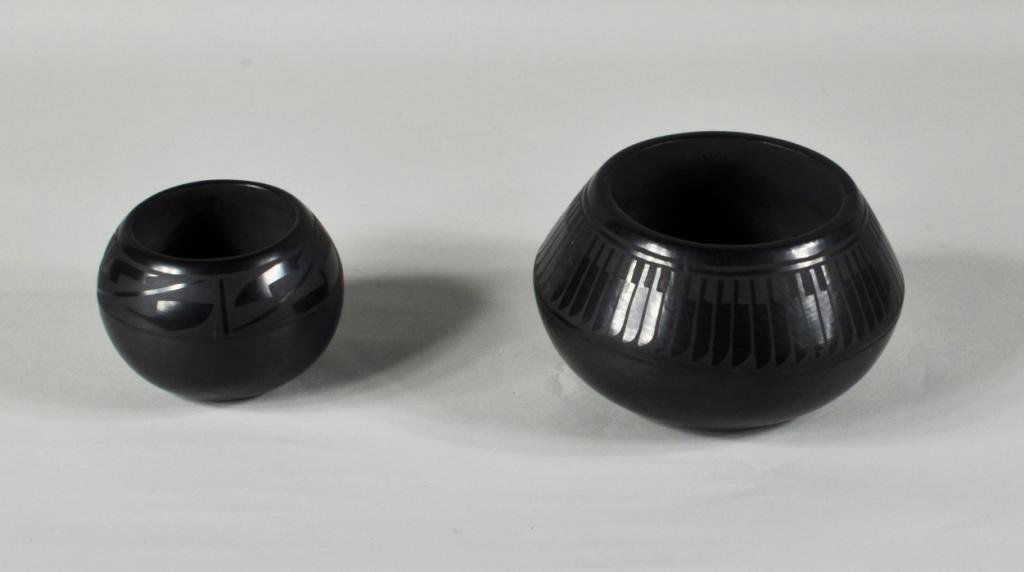 Florence Naranjo, Two San Ildefonso Pots: Two San Ildefonso pots by Florence Naranjo, comprising a feather pot signed on base Florence Naranjo San Ildefonso Pue, and a smaller pot signed on base Florence Naranjo. Largest: 4" high, 6 1/2" diam