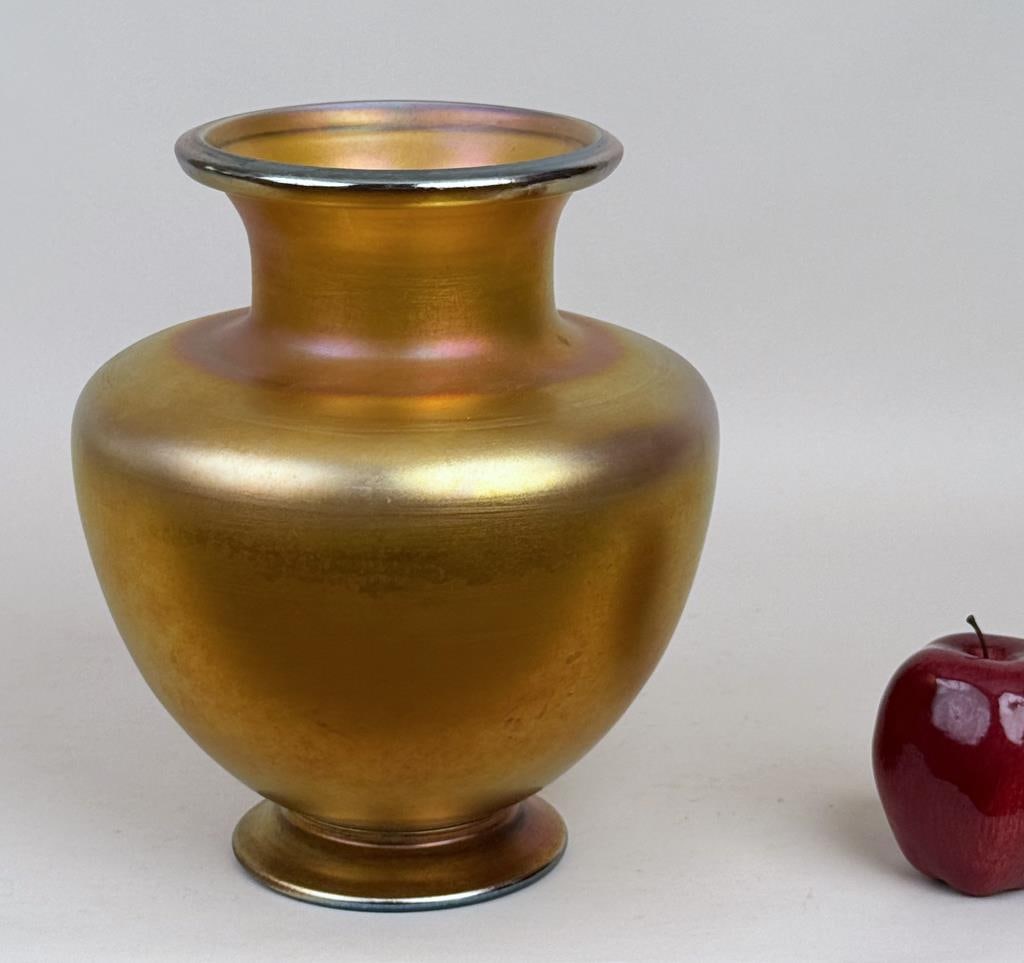 Large Tiffany Furnace Favrile Glass Vase: footed bulbous baluster form with flared rim, signed underside "Louis C. Tiffany Furnaces, Inc. Favrile" and numbered 1154. 10" high, 8 1/2" diameter.