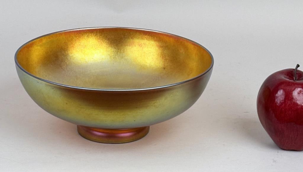 Steuben Golden Yellow Aurene Bowl: iridescent gold, yellow, and blue tones, marked Steuben and numbered 550-10 to underside. 3 1/2" high, 8 3/4" diameter.