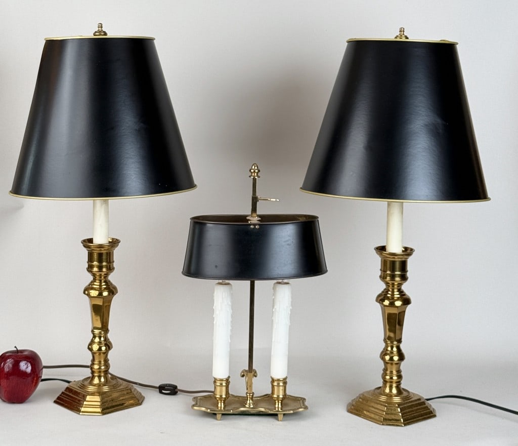 Three Brass Tone Table Lamps: comprising a pair of brass candlestick form and one brass bouilliotte style. Largest: 25 1/4" high, 12" diameter shade.