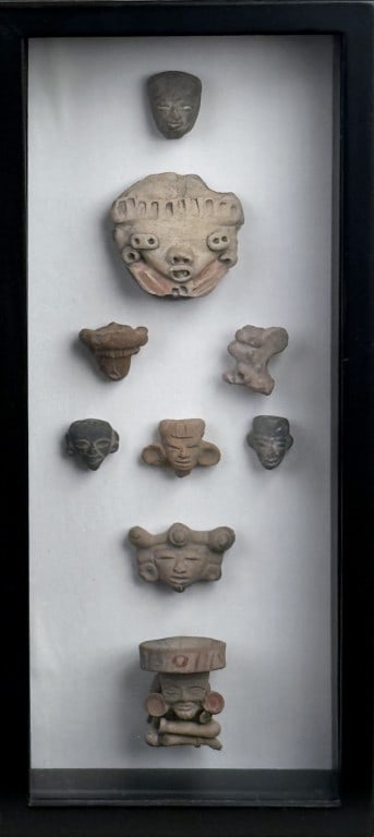 Framed Group Pre-Columbian Artifacts: comprising nine various figures. Frame size: 15 1/4" high, 6 7/8" wide, 2 3/8" deep. Frame wear.